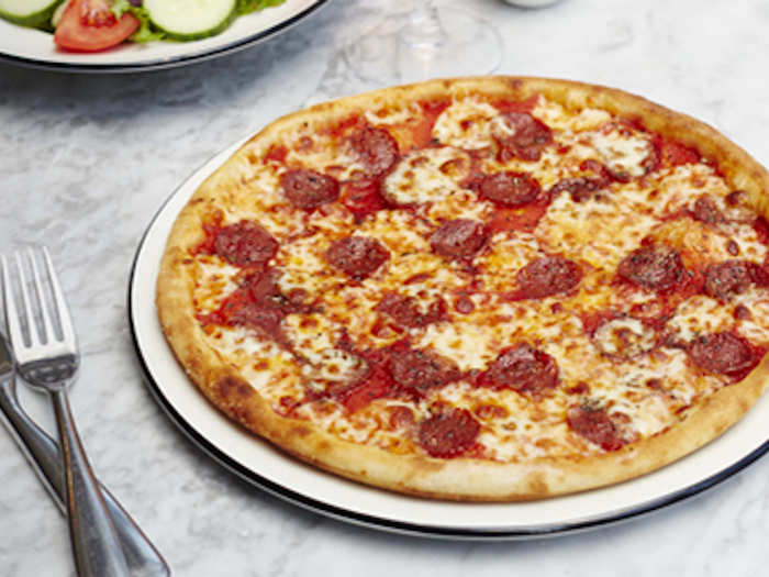This classic American Pizza from Pizza Express, topped with pepperoni, mozzarella and tomato, looks perfectly round and piping hot...