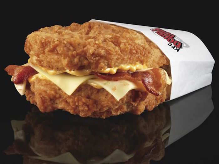 The indulgent KFC Double Down should contain bacon and two kinds of melted cheese, sandwiched between two pieces of fried chicken...