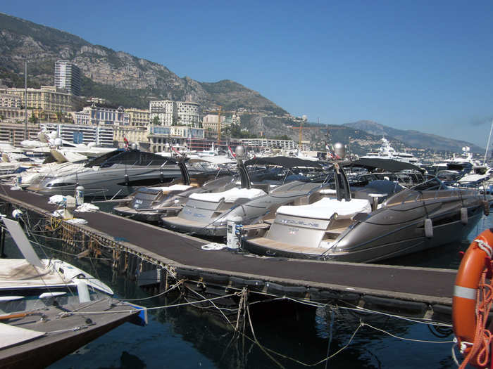 There were a number of silver Riva Rivale boats in a row. One is labeled "YCM" for Monaco Yacht Club.