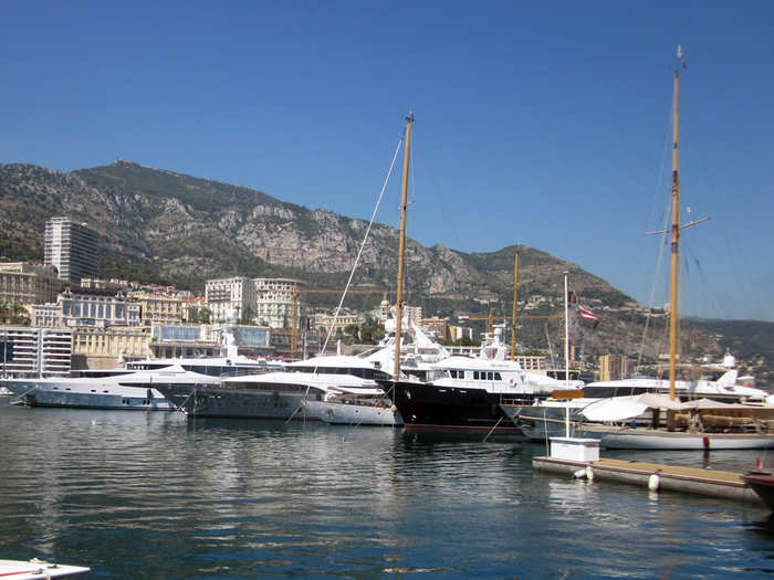 There was an entire row of sailing yachts, which were sleek and long.