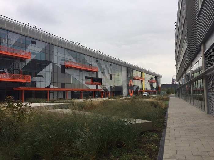 The courtyard features a number of green spaces and seating options.