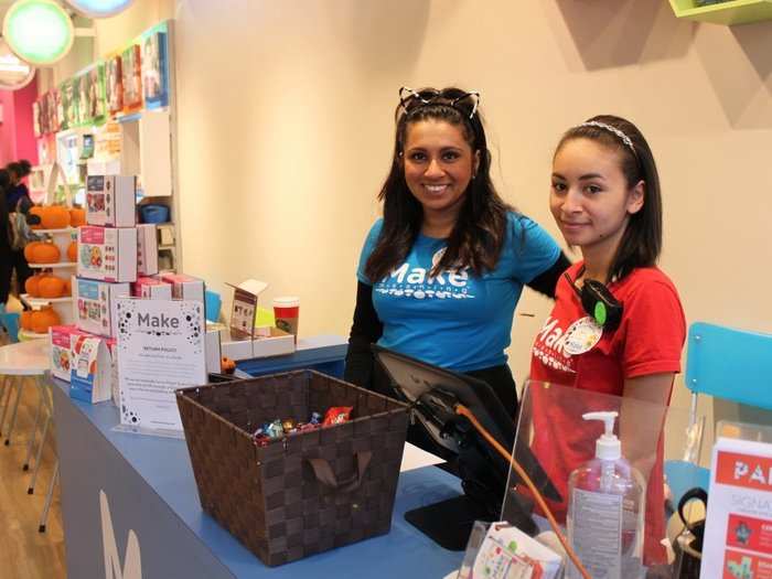 Other stores kept it simple. Xiomara, right, said it was a slow day, business-wise, but they had one bucket of candy on hand. "As soon as it