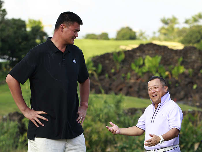 Here is Yao Ming with Hong Kong actor Eric Tsang.