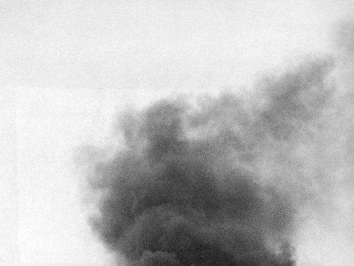 A cloud of black smoke rises from a blazing Nazi fighter that crashed and burst into flames after having been shot down in an air battle over Sussex, September 8, 1940.