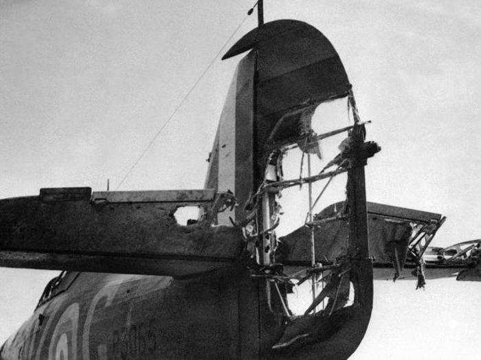 The tail of a British Hurricane fighter that has been in a battle with Nazi planes over the Channel, at an airfield somewhere in England, Sept. 6, 1940. Despite riddled control surfaces, the plane made a safe landing.