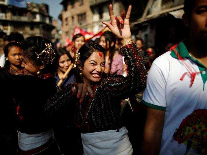 Participants from Newar community in traditional attire, dance during the Newari New Year parade that falls during the Tihar festival, also called Diwali, in Kathmandu, Nepal.