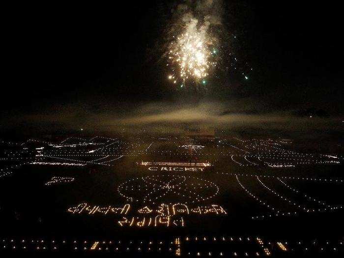 Candles are arranged to form a tribute to the Indian army inside a cricket stadium on the eve of Diwali, the Hindu festival of lights in Allahabad, India.