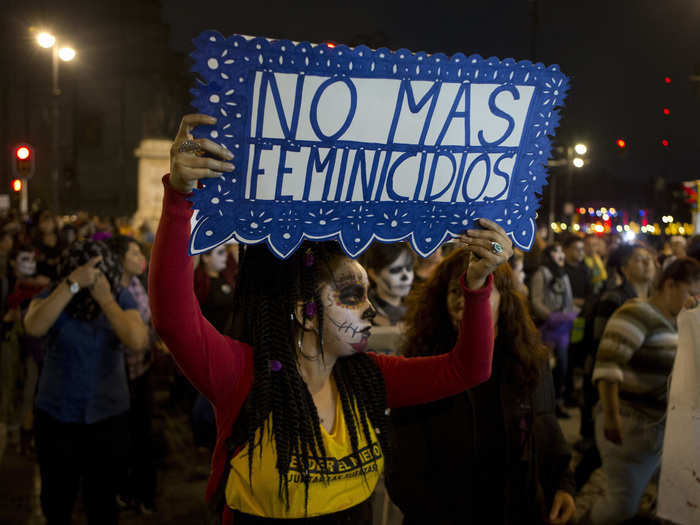 Dressed as Catrinas, female protestors held signs and chanted "We want ourselves alive."