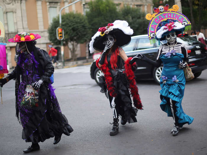 Women often dress up as La Calavera Catrina, a popular Mexican skeleton character from the early 1900s who wears a large hat.