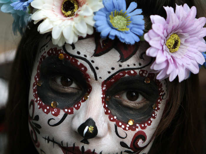 Some people incorporate flower crowns, glitter, and jewels into their costumes.