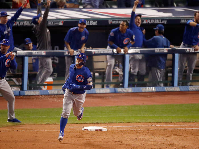 The Cubs dugout reacts to Javier Baez