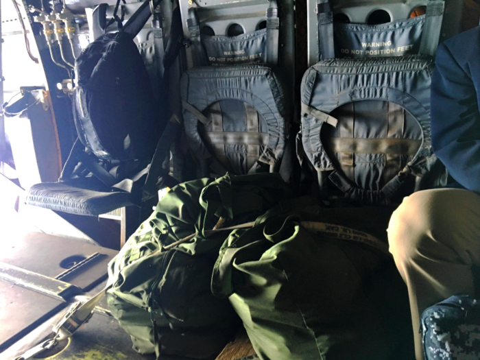 Built for utility, the interior of the MV-22B is bare bones. Unused seats are folded up against the wall of the aircraft and cargo is tied to the floor.