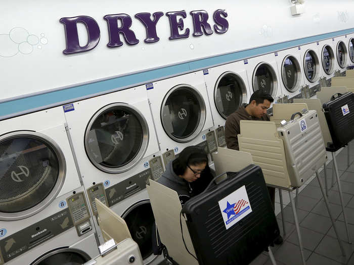 Voters at the Su Nueva laundromat in Chicago, Illinois, cast their ballots.