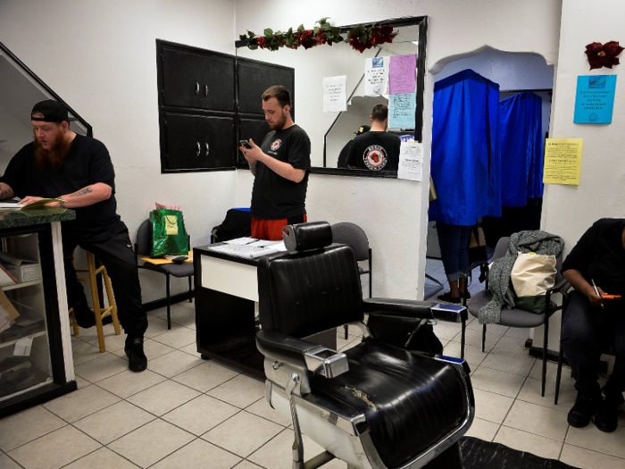 People cast their votes in a Philadelphia barbershop.