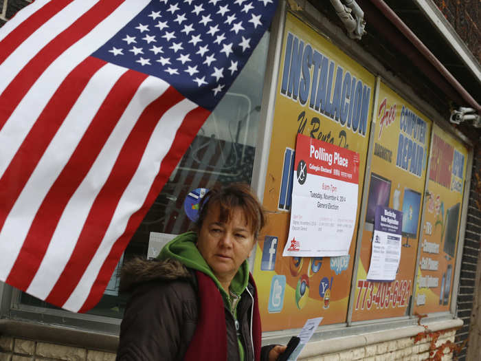 A voter leaves a computer repair shop being used a polling station in Chicago, Illinois.