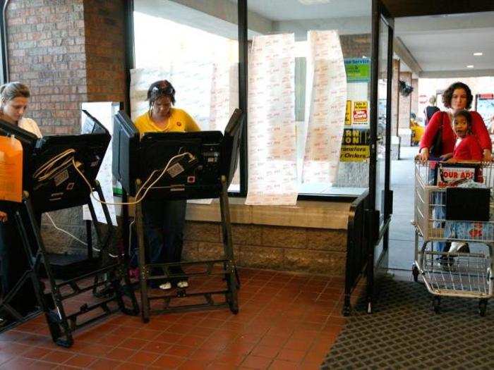 Voters cast their ballot inside a Kroger grocery store in Columbus, Ohio.