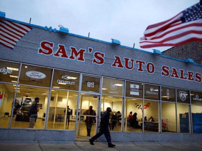 A voter leaves a car dealership being used as a polling station in Chicago, Illinois.