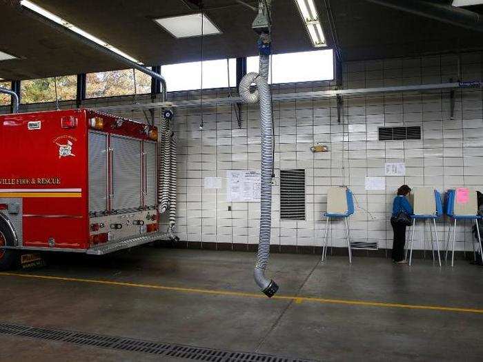 People vote at the Louisville Fire department Engine Co. No. 11 polling station in Louisville, Kentucky.