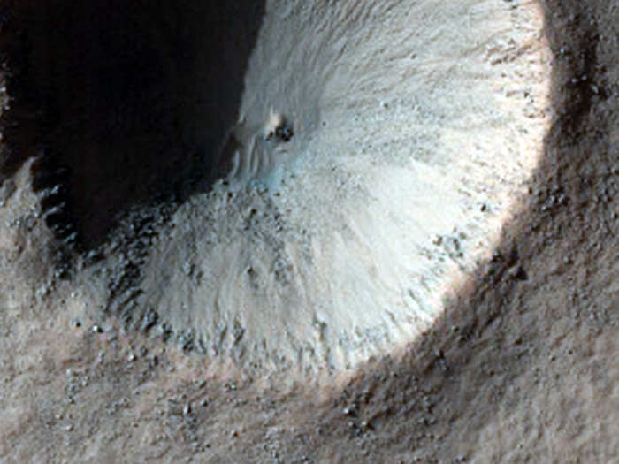 This crater near a region called Aonia Terra looks like part of the Death Star.