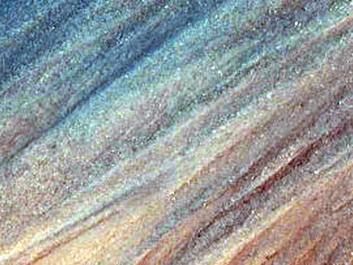 A rainbow-colored sprinkling of minerals on a Martian slope.