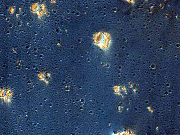 False colors assigned to certain minerals make Syria Planum an inky blue that