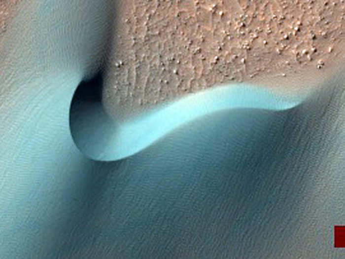 Dunes in a Martian crater. The red bar is an artifact of NASA