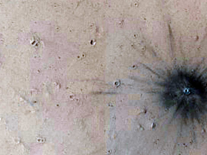 A recent impact crater on Mars. (We