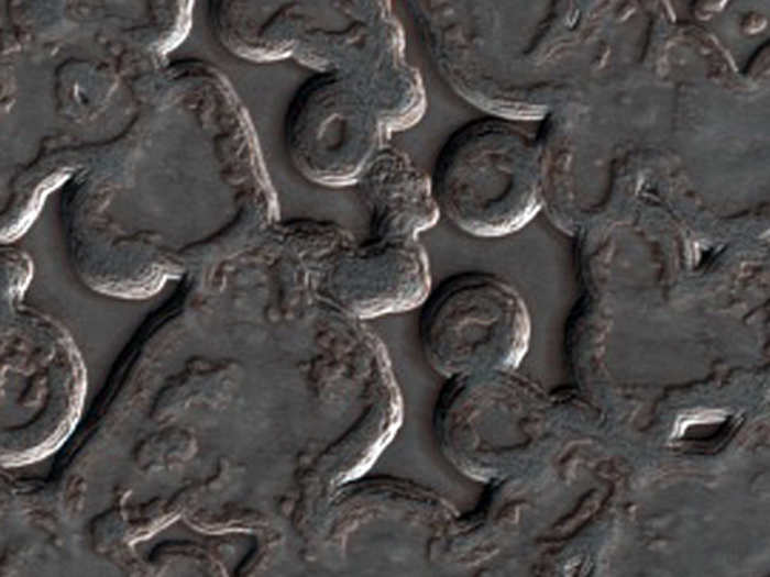 Carbon dioxide that turns from solid to gas carves out these strange shapes at Mars