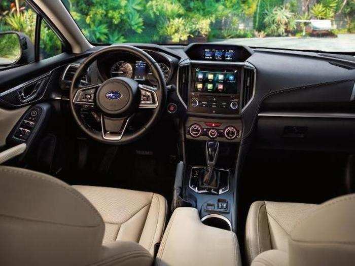 The Impreza has a center console with Subaru