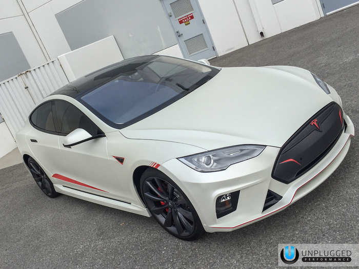 9. Located in Hawthorne, California, Unplugged Performance offers customizations specifically for Tesla cars. This Model S was customized to have red racing stripes, a front spoiler, and some sportier headlights.