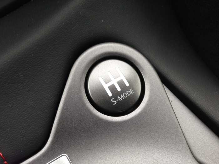 Push this button and the transmission will also match revs, so that you can have nice, smooth downshifts.