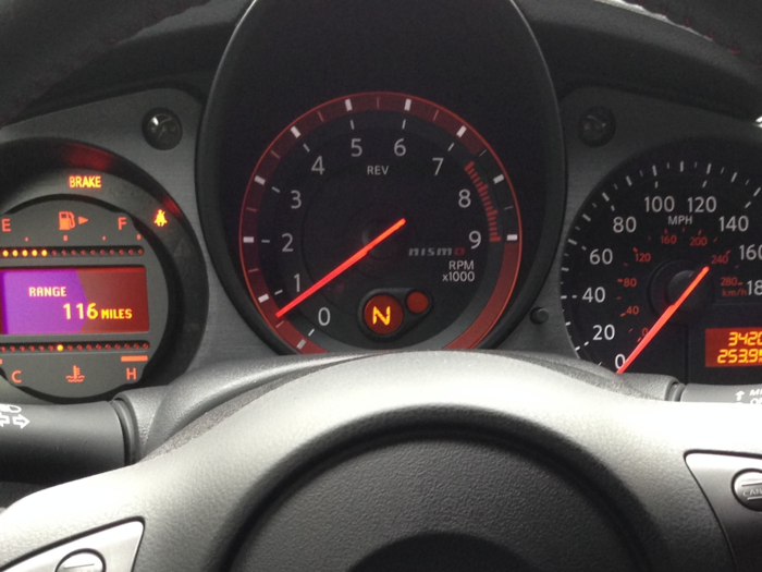 The instrument cluster is old-school and purposeful, with the tachometer front and center.