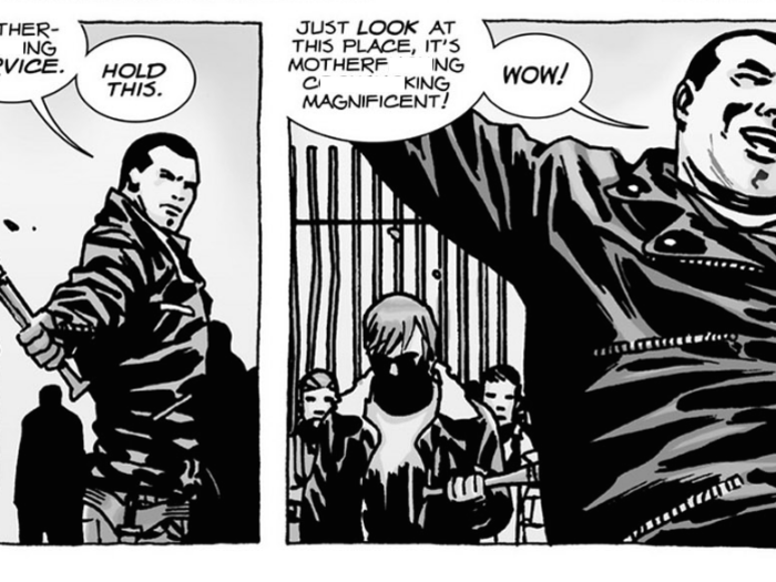 Negan hands off his bat Lucille to Rick to hold before throwing out his arms to marvel at the community.