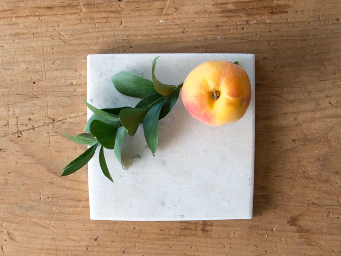 These white marble bases come in two sizes and two shapes (square and round). They