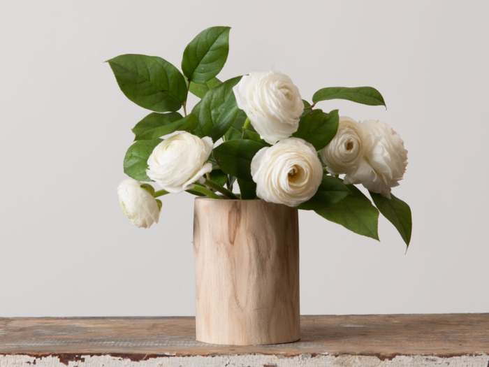 Take a detour from traditional vases with this log vase. Each one is unique.