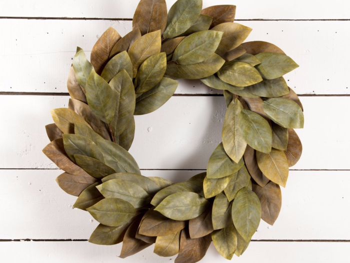 This wreath made with faux magnolia leaves still looks festive but more minimalistic.