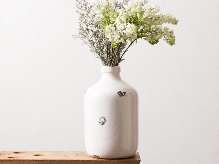 This white jug vase adds a rustic feel to your space. Bonus points for adding in wildflowers.