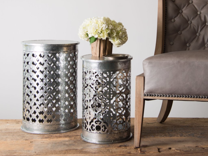 These metal side tables are intricate and add a touch of industrial design to the country aesthetic.