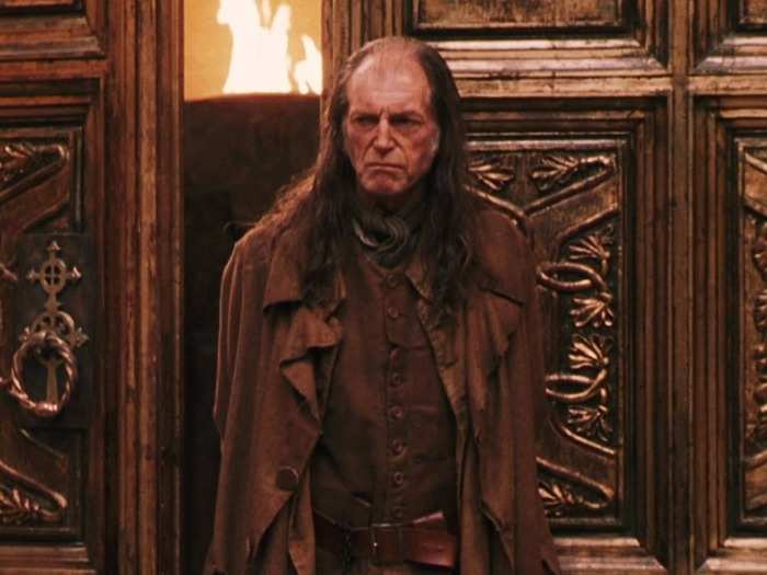 THEN: David Bradley portrayed the ever-shifty cat lover Argus Filch.