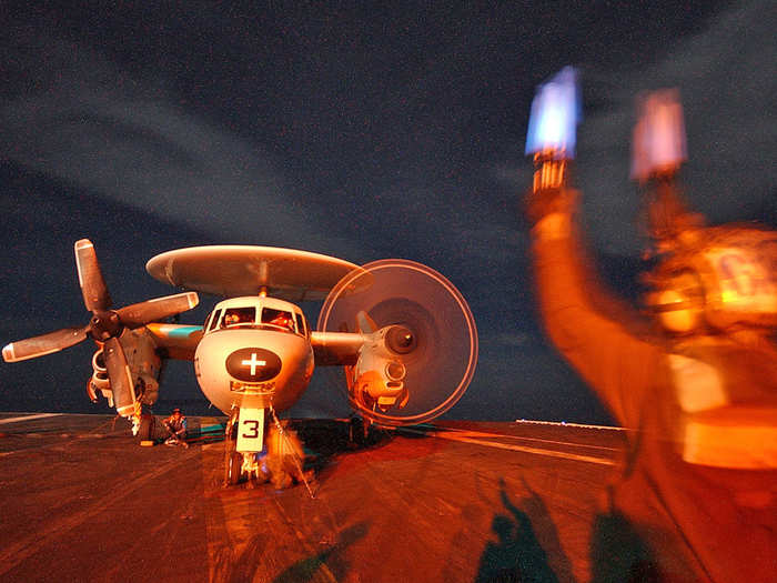 Also, US carriers use a whole team of aircraft: Transport planes handle logistics; electronic warfare squadrons backup fighters; airborne warning and control planes (AWACS, like the E-2 Hawkeye pictured below) transmit huge amounts of targeting data from the sky; helicopters hunt submarines and move personnel.