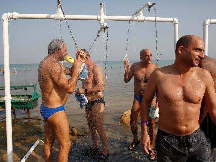 After completing their swim, swimmers washed the irritating, salty water off of their skin.