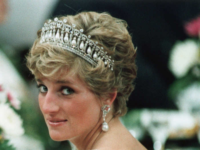 November 12, 1990: One of the most remarkable photos ever taken of Princess Diana, she wore this open-backed beaded dress to a banquet for Japanese Emperor Akihito in Tokyo.