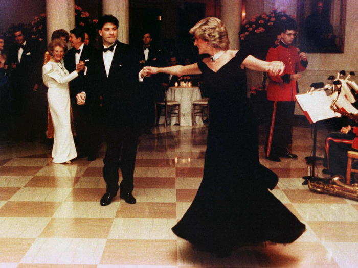 November 9, 1985: This image of Princess Diana dancing at the White House with John Travolta has become one of her most memorable, partly due to the ink-blue Victor Edelstein gown she wore.