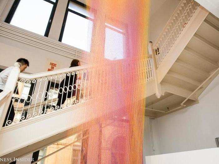 One of the most remarkable pieces of art hangs in the staircase between the eighth and seventh floors. This piece incorporates thousands of strands of thread connecting the ceiling to the floor. As you walk up the stairs, it shimmers and appears to move.