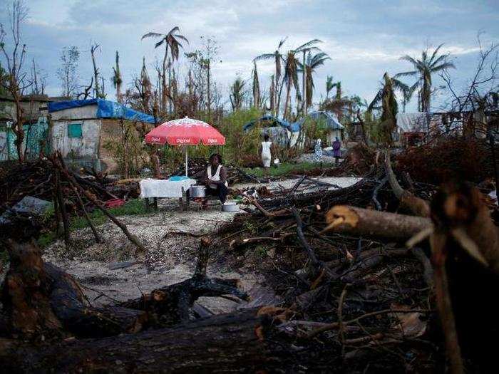 A food vendor waits for customers after Hurricane Matthew hit Jeremie, Haiti, on October 18.