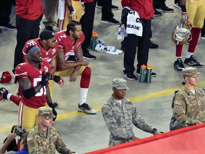 San Francisco 49ers quarterback Colin Kaepernick and teammate Eric Reid kneel during the playing of the national anthem before a game against the Los Angeles Rams at Levi