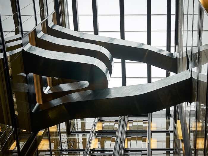 A floating staircase links some of the upper floors in the 11-storey building.