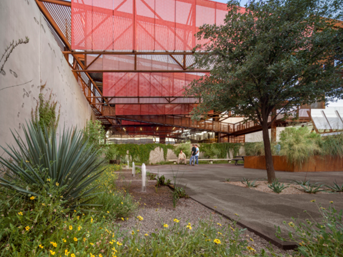 Constructed in 2014, the 216,000-square-foot port features a processing station for vehicles and pedestrians, a lush garden, and a system that allows it to collect and recycle rainwater.