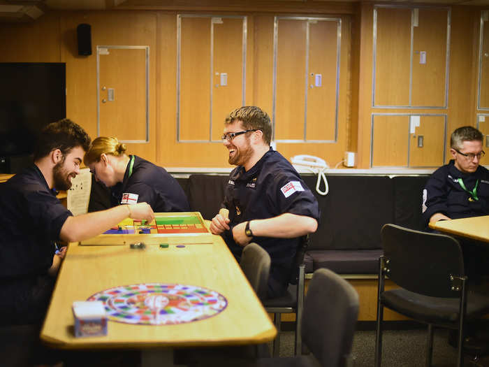 Sailors also relax in the mess playing Vickers.