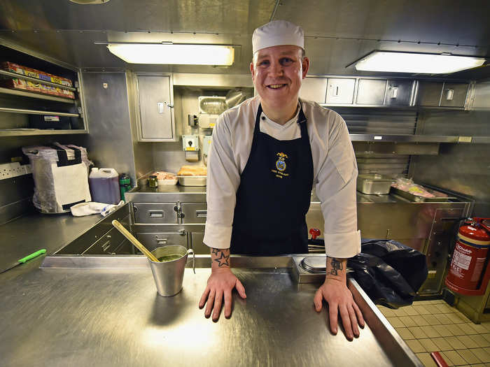 A chef preparing a curry inside the galley, where the ship